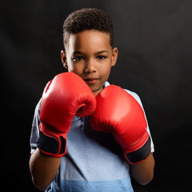 Kids are taught boxing at Elite Fitness Classes in Columbia, Ellicott City, Baltimore Maryland